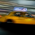 NYC Taxi Cab speeds through traffic.