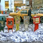 Newspaper boxes in the Snow. West Broadway in SoHo